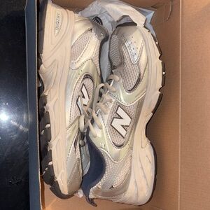 New Balance Silver and Gray Athletic Shoes